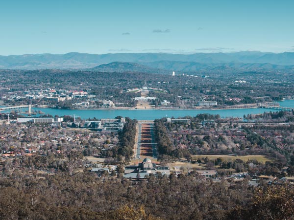 Urban area, Sky, Metropolitan area, City, Cityscape, Aerial photography, Hill, Tree, Cloud, Infrastructure, Mountain, Photography, Bird's-eye view, Residential area, Metropolis, Landscape, Suburb, Bridge, Architecture, Skyline, ANZAC Parade