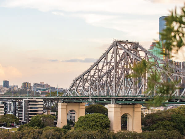 Bridge, Metropolitan area, Urban area, Sky, Architecture, City, Cantilever bridge, Tree, Cable-stayed bridge, Skyway, Cityscape, Nonbuilding structure, River, Overpass, Metropolis, Brisbane, Hervey Bay
