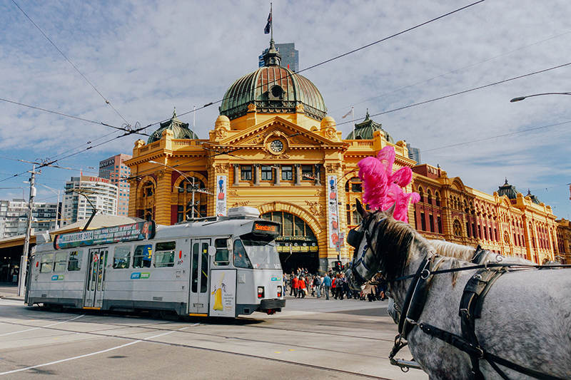 Transport, Landmark, Mode of transport, Tram, Town, Vehicle, Architecture, Street, City, Urban area, Metropolis, Electricity, Tourism, Building, Public transport, Pedestrian, Travel, Thoroughfare, Electrical supply, Bus, Flinders Street Station, Flinders Street railway station, Flinders Street railway station, Flinders Street railway station, Flinders Street railway station, Flinders Street railway station, Flinders Street Railway Station, Train, Fed Square, Collins Street, Flinders Street, Train station, Southern Cross Station