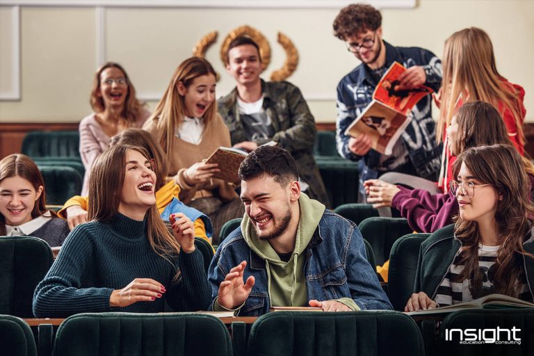 Hair, Face, Mouth, People, Social group, Facial expression, Sharing, Youth, Jacket, Conversation, Brown hair, Sweater, Laugh, Student, Education, College